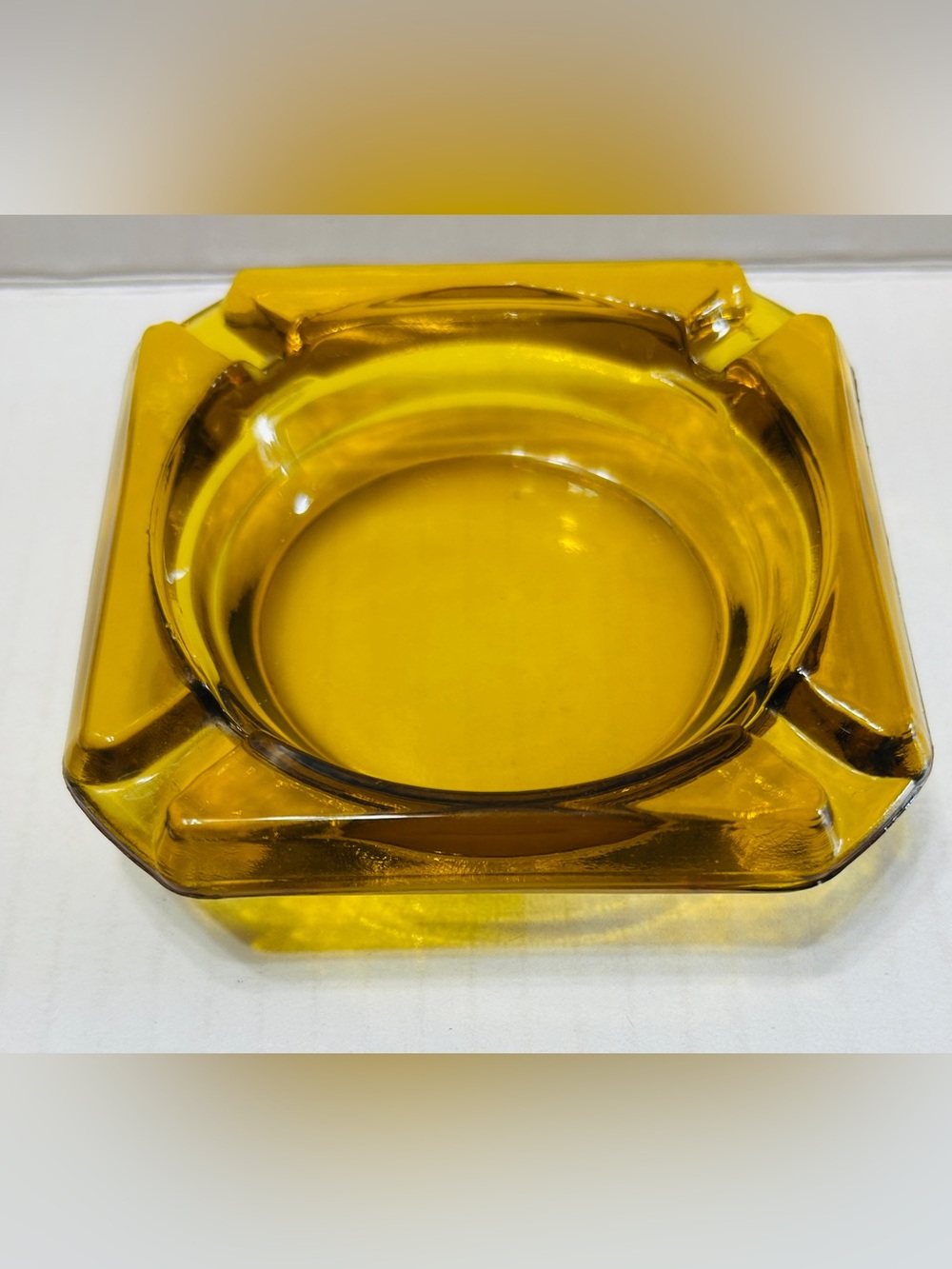 Vintage 1970’s amber ashtray with 4 slots.